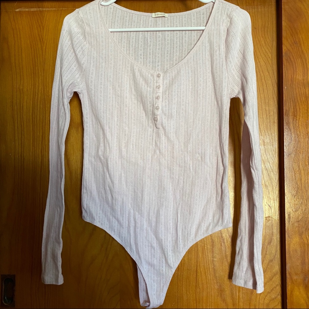 Soft pink body suit